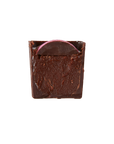 Bubs- Dark chocolate brut rosé caramel bon bon cut in half