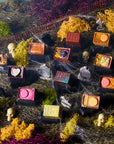 Colorful Bon Bons with various designs on a graveyard with decorative elements.