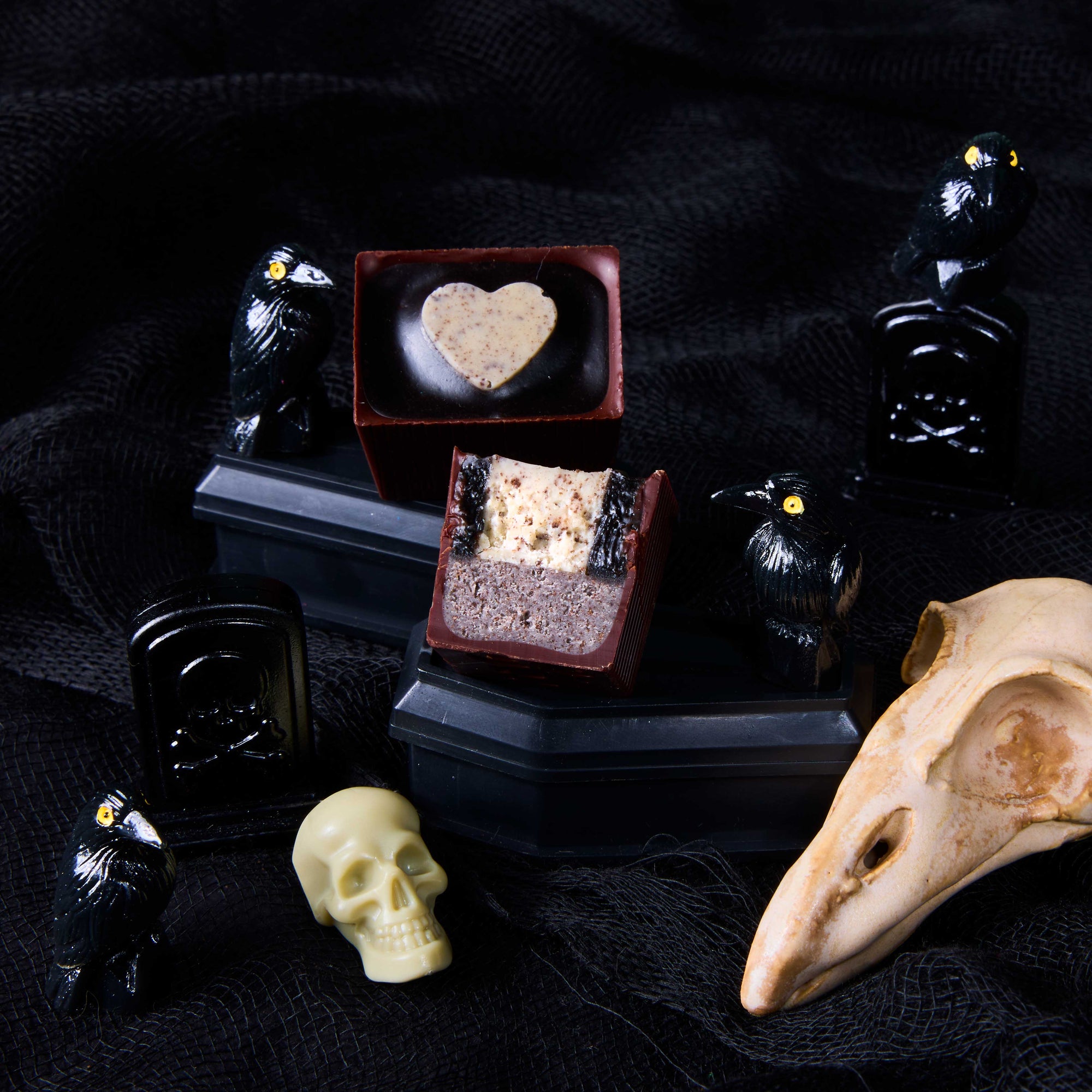 Black Like My Heart Bon full and cross section on a mini black coffin with ravens and skulls