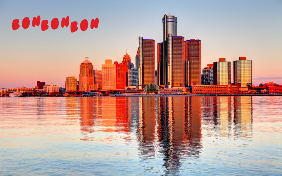 skyline of Detroit on the water. text of Bon Bon Bon in red int the corner