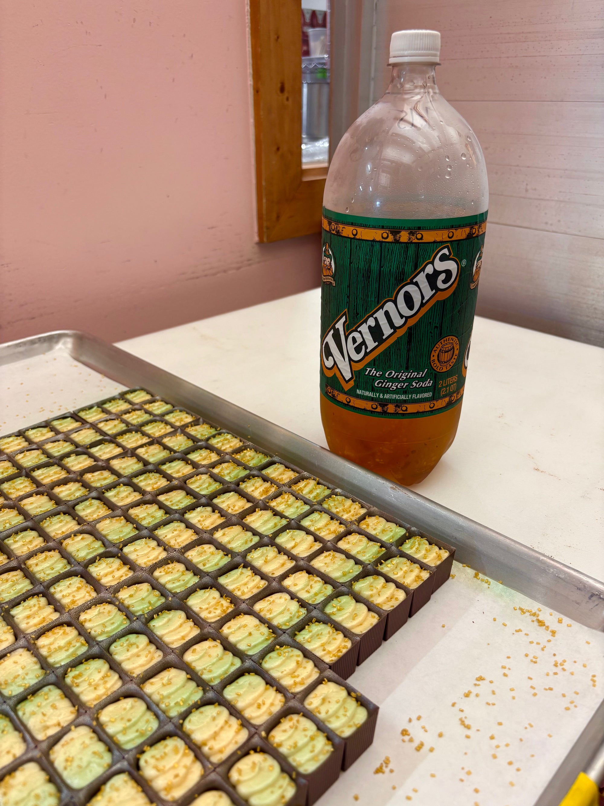A tray of Bons with a Bottle of Vernor's