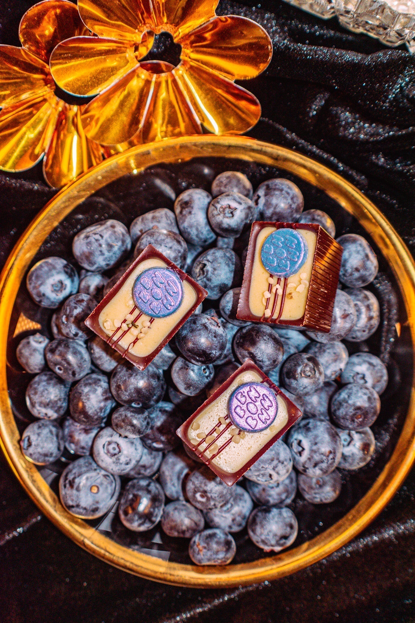 Three Bons in a bowl of blueberries