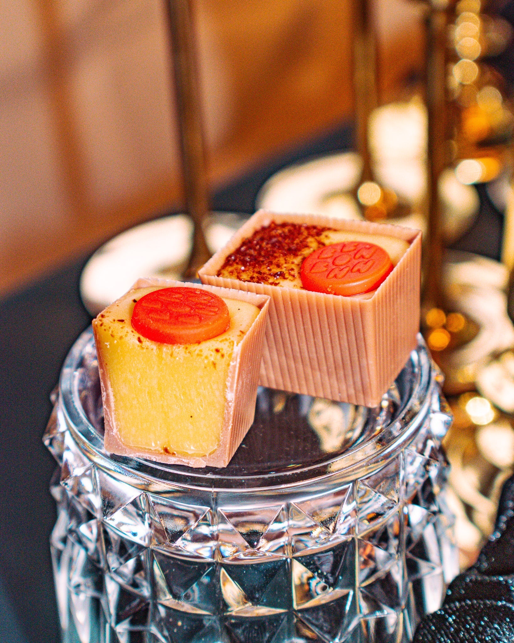 Bon and half a Bon sitting on a glass jar