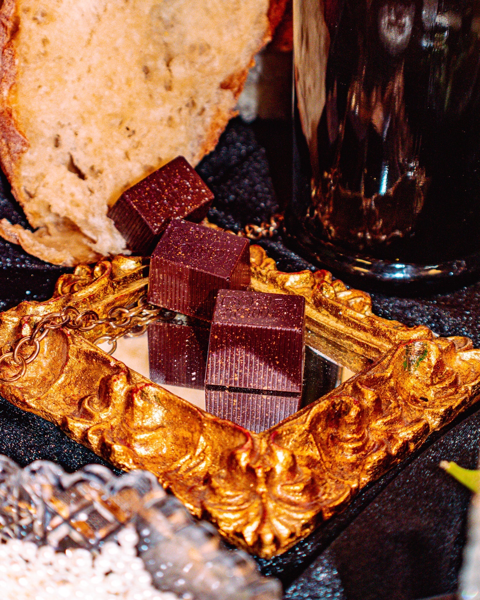 Three Bons on top of a mirror with a slice of toast in the background.
