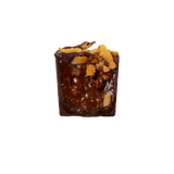 The Rustler Ranger cookie caramel ganache with coconut and oats bon bon cut in half