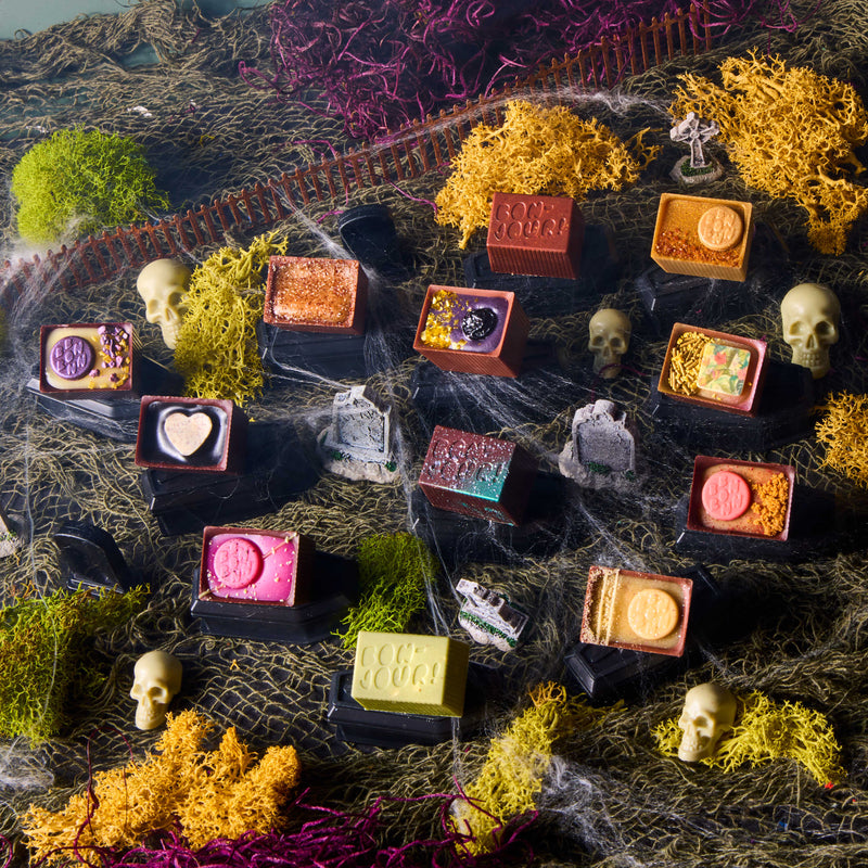 Colorful Bon Bons with various designs on a graveyard with decorative elements.
