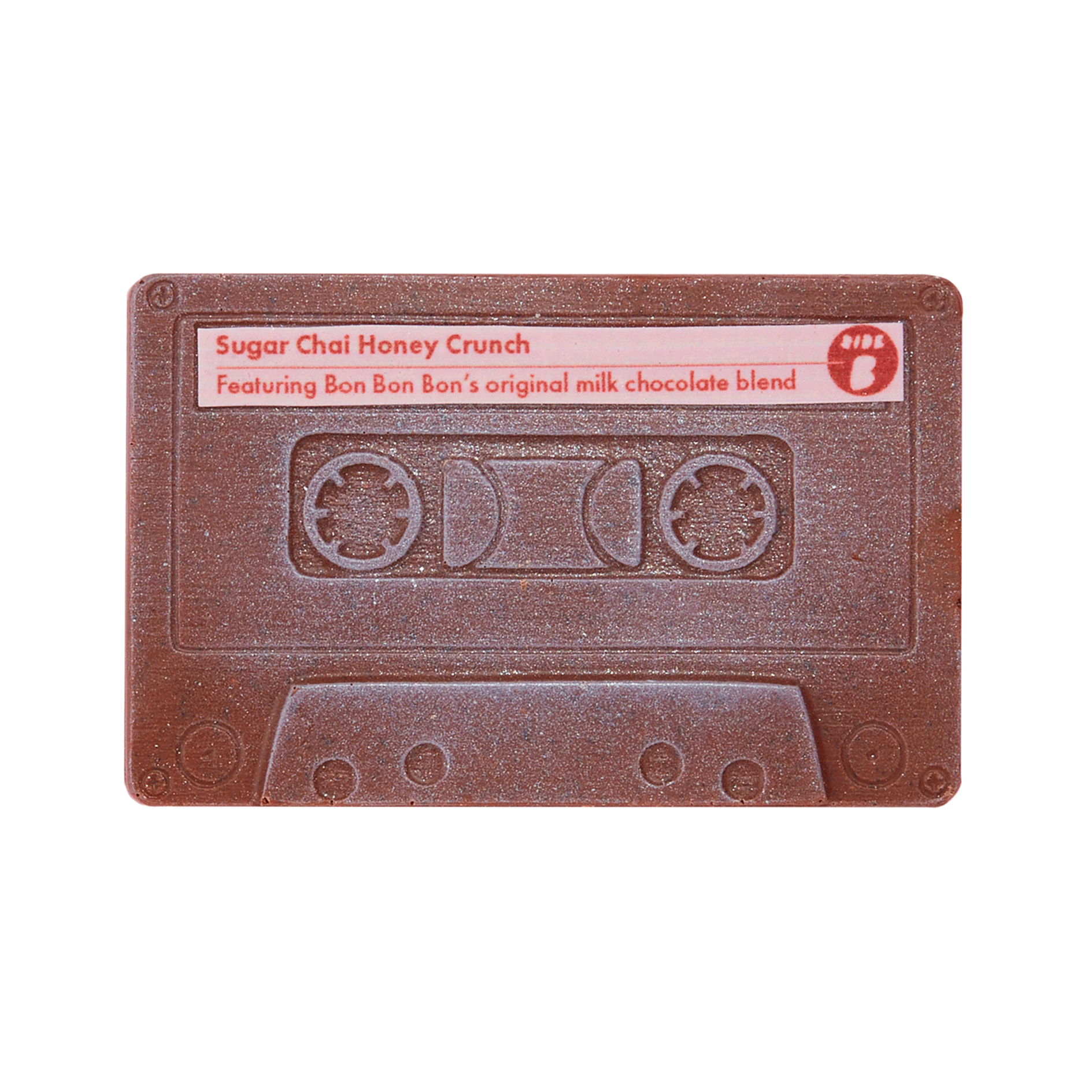 A chocolate cassette tape with 'Sugar Chai Honey Crunch' text and a note mentioning Bon Bon's original milk chocolate blend.