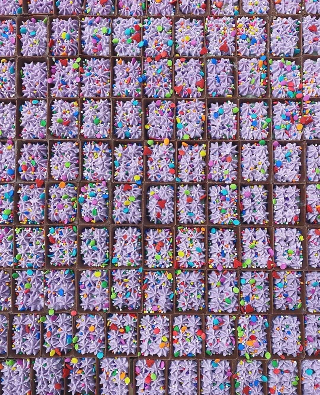 Tray of purple Cake Bon Bons with party sprinkles