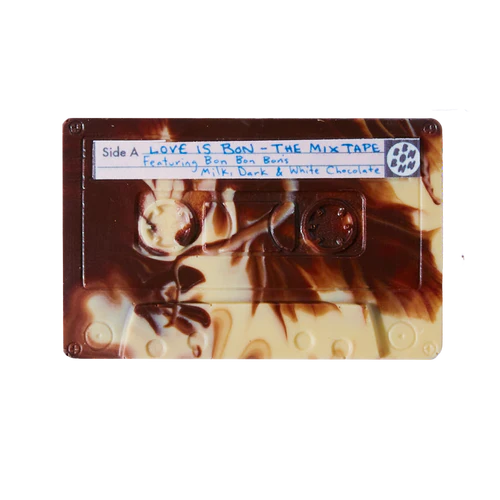 Cassette tape-shaped chocolate bar with a label on a white background