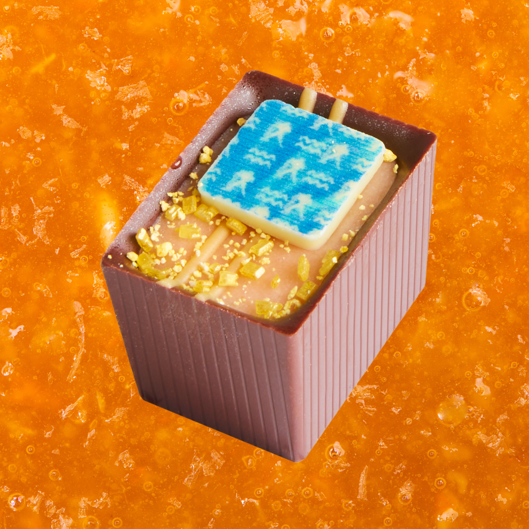 Aquarius Bon with a blue square piece on an orange textured background