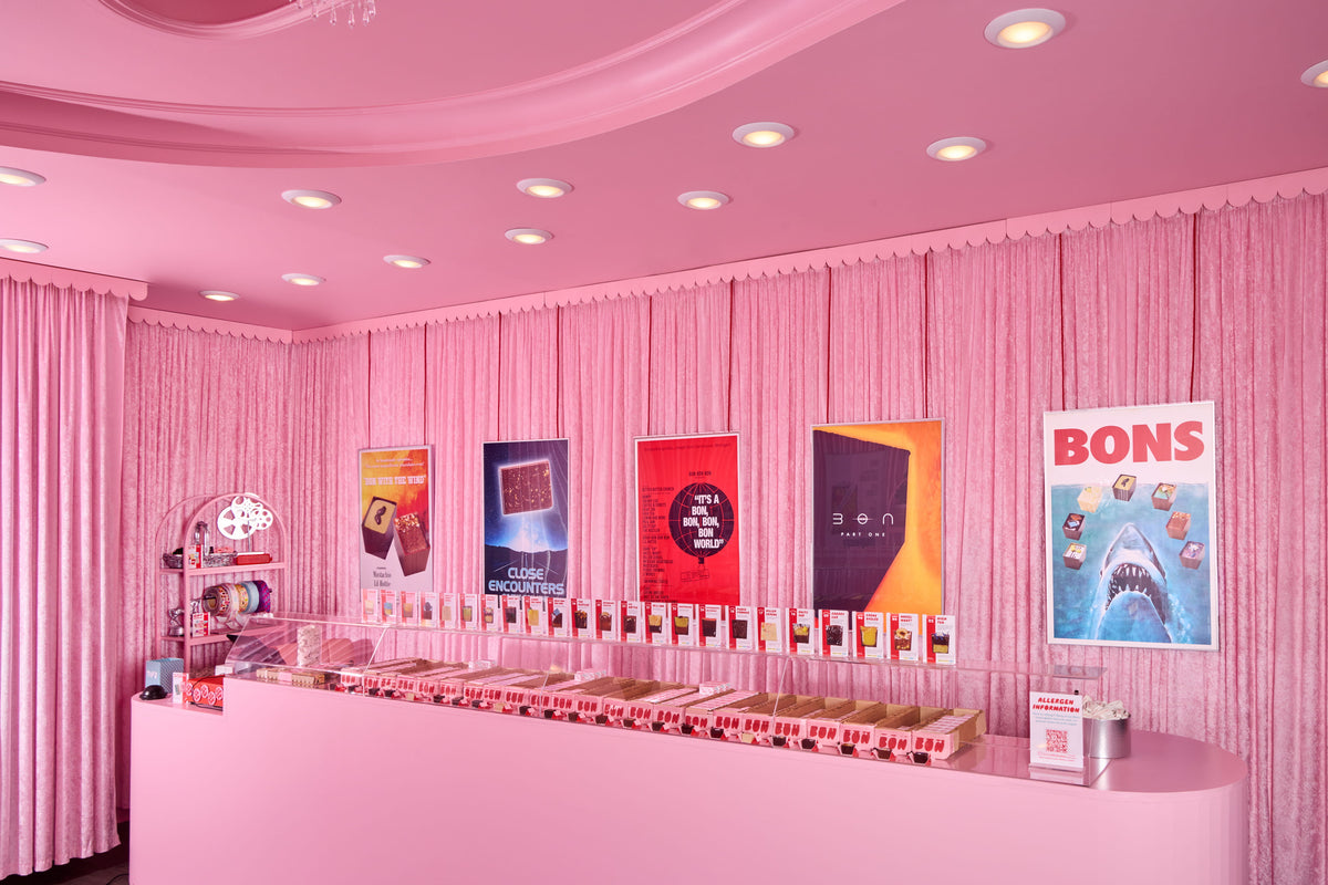 The counter inside Bon Bon Bon's movie theater-inspired shop in Birmingham, Michigan, with all of the Bons on display